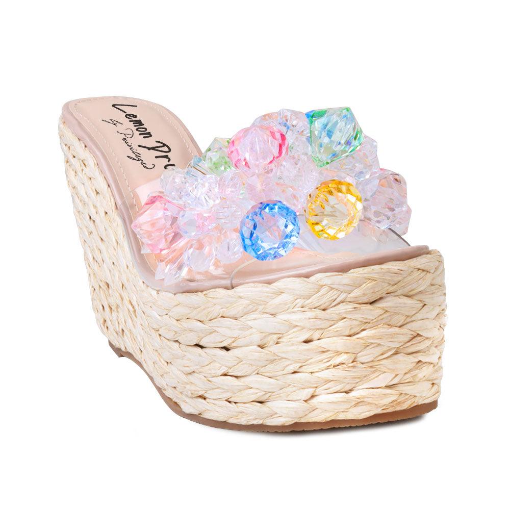 Clear vinyl upper with rhinestones women's slip on platform heel in nude-corner view