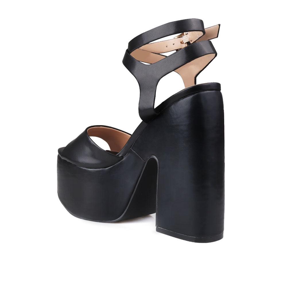 Black leather women's block heel with platform-posterior view