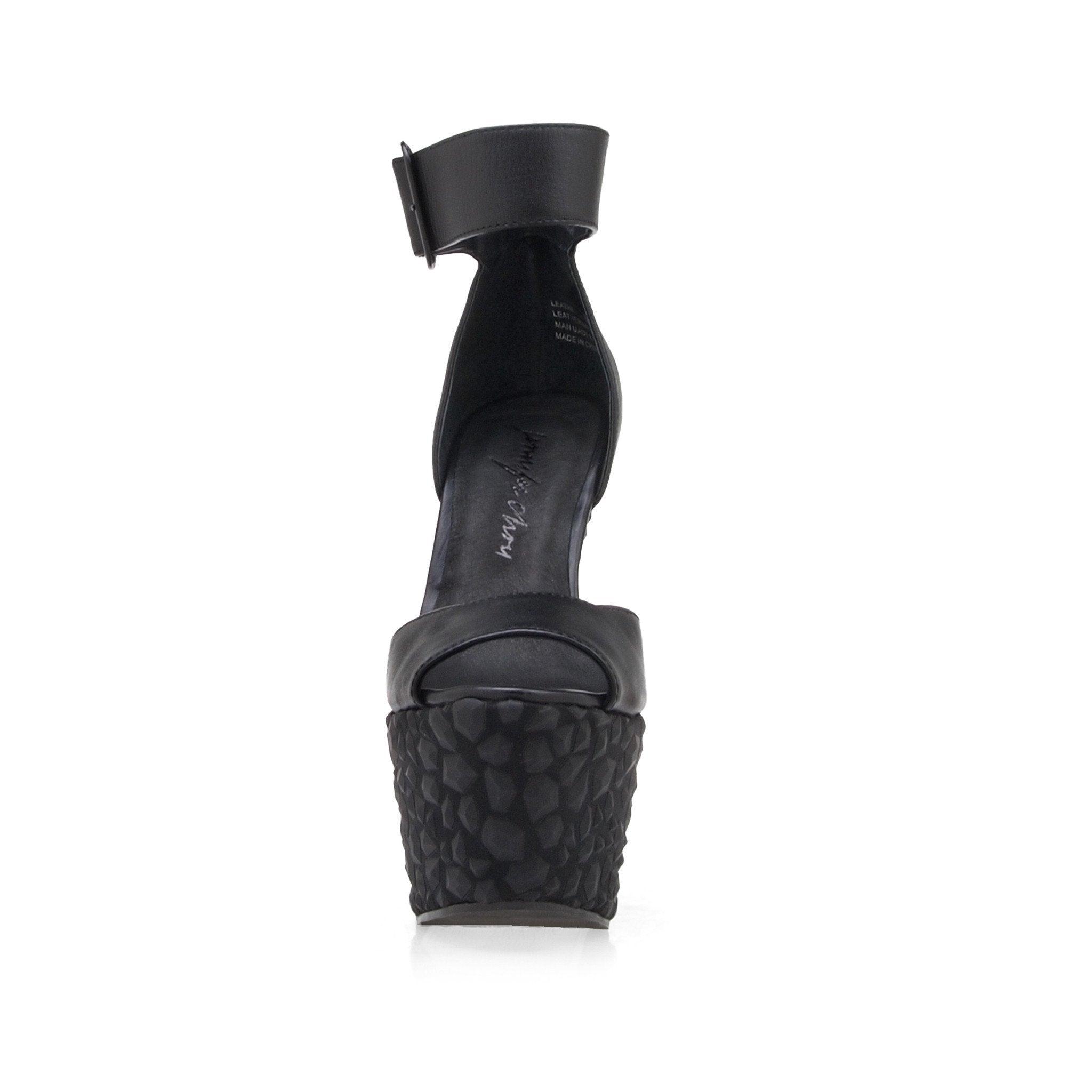 Leather wedge women's heel in black-front view