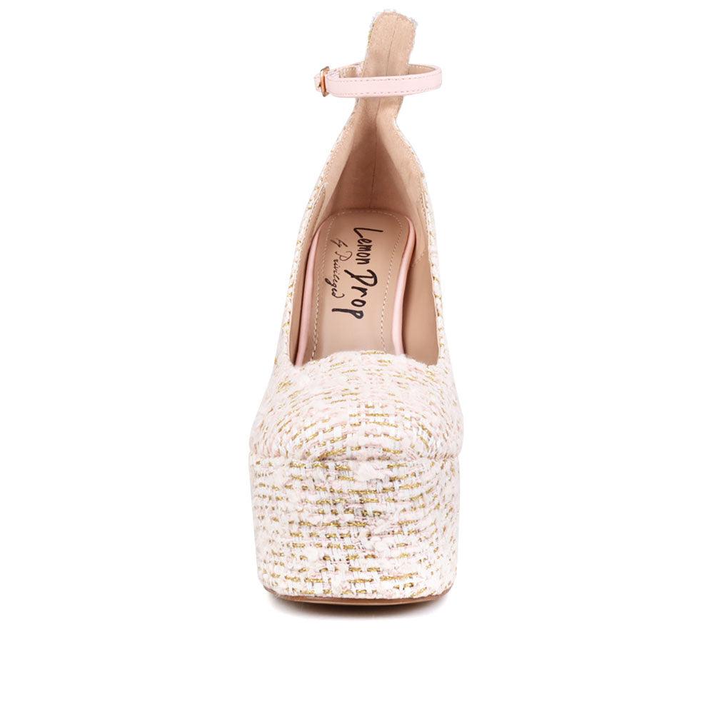 Cream colored women platforms with ankle buckle closure-front view