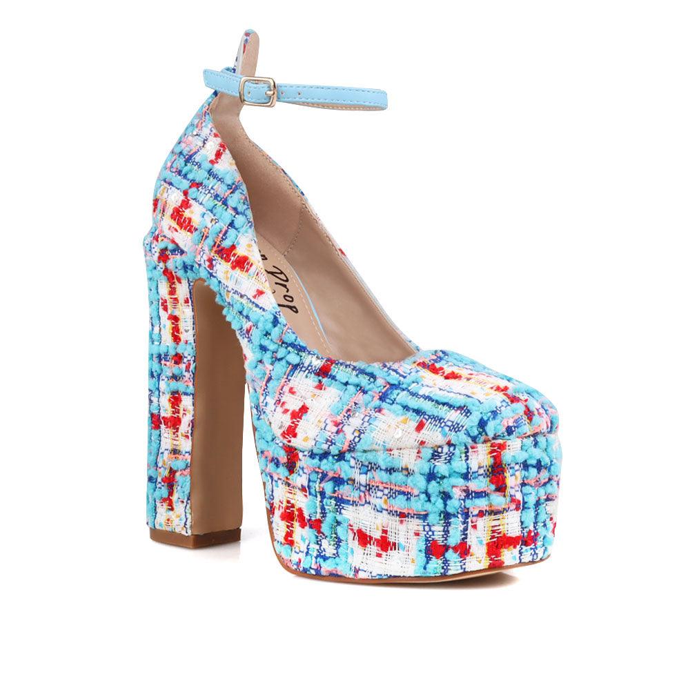 Blue and white colored women platforms with ankle buckle closure-corner view