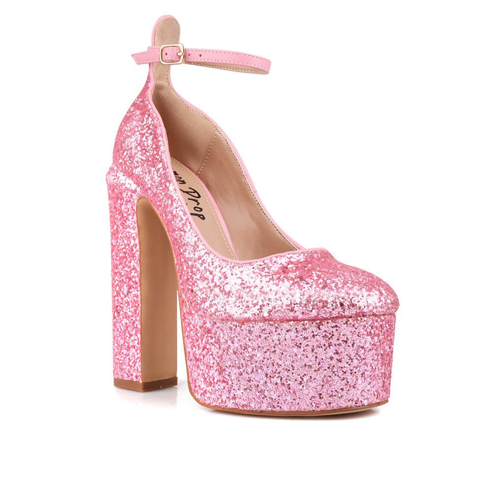 Pink colored women platforms with ankle buckle closure-corner view