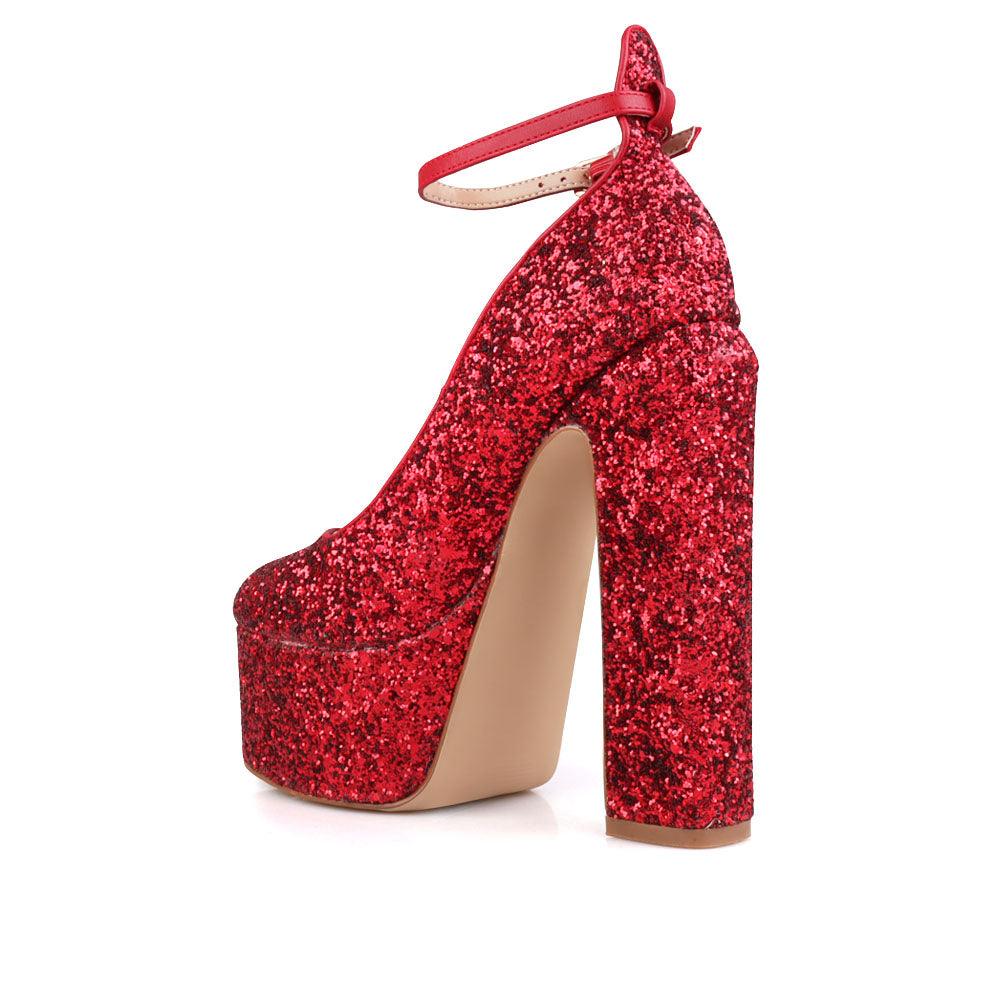 red colored women platforms with ankle buckle closure-posterior view