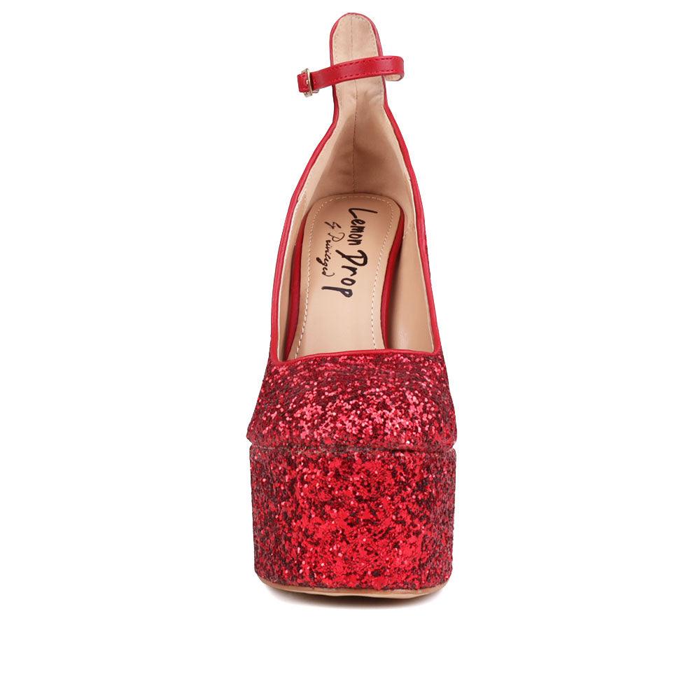 red colored women platforms with ankle buckle closure-front view