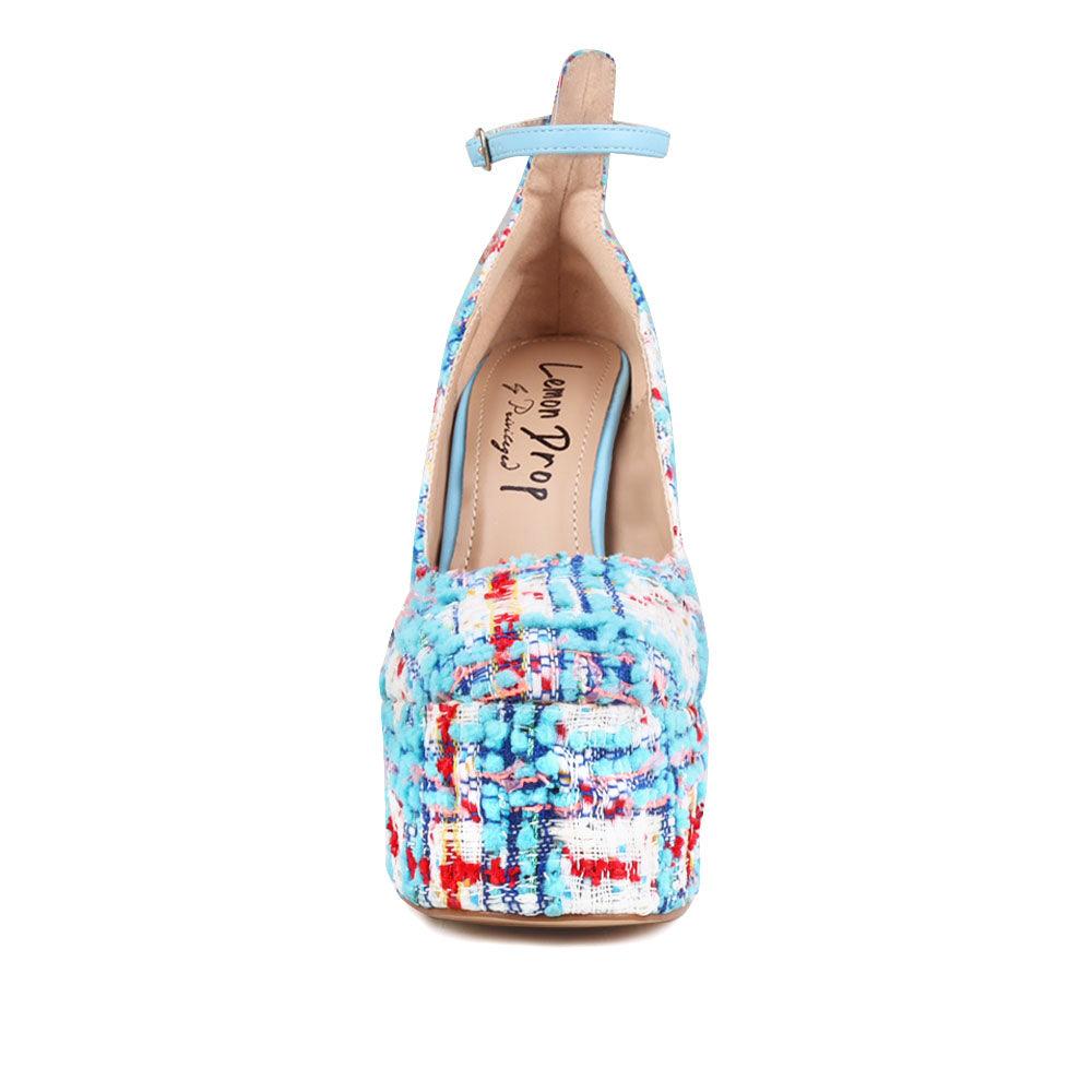 Blue and white colored women platforms with ankle buckle closure-front view