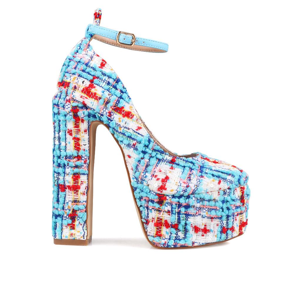 Blue and white colored women platforms with ankle buckle closure-side view