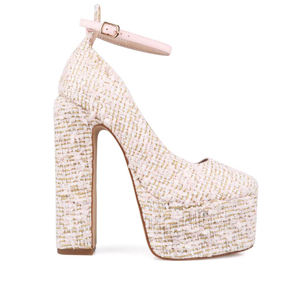 Cream colored women platforms with ankle buckle closure-side view