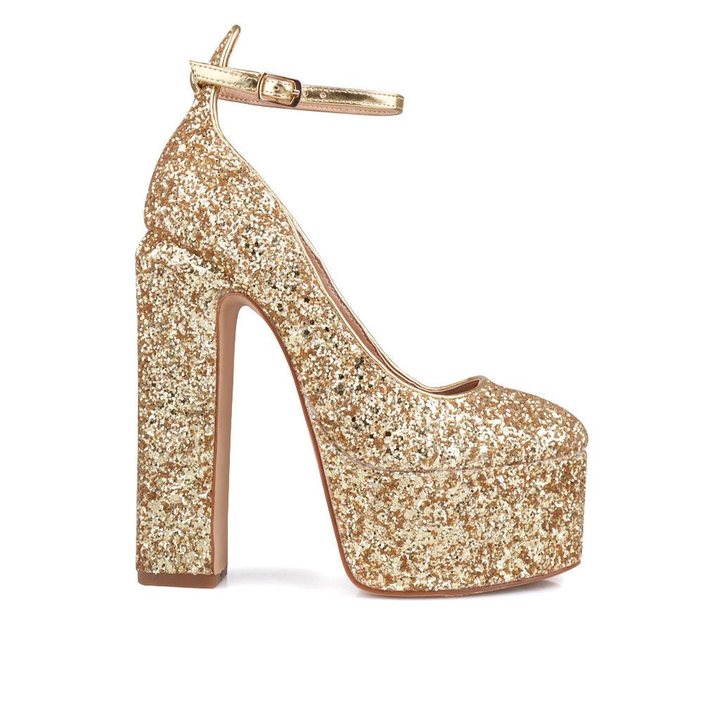 Golden colored women platforms with ankle buckle closure-side view