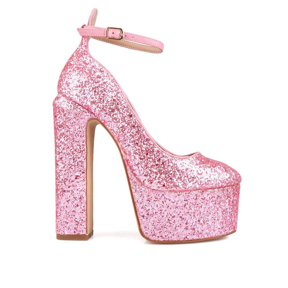 Pink colored women platforms with ankle buckle closure-side view