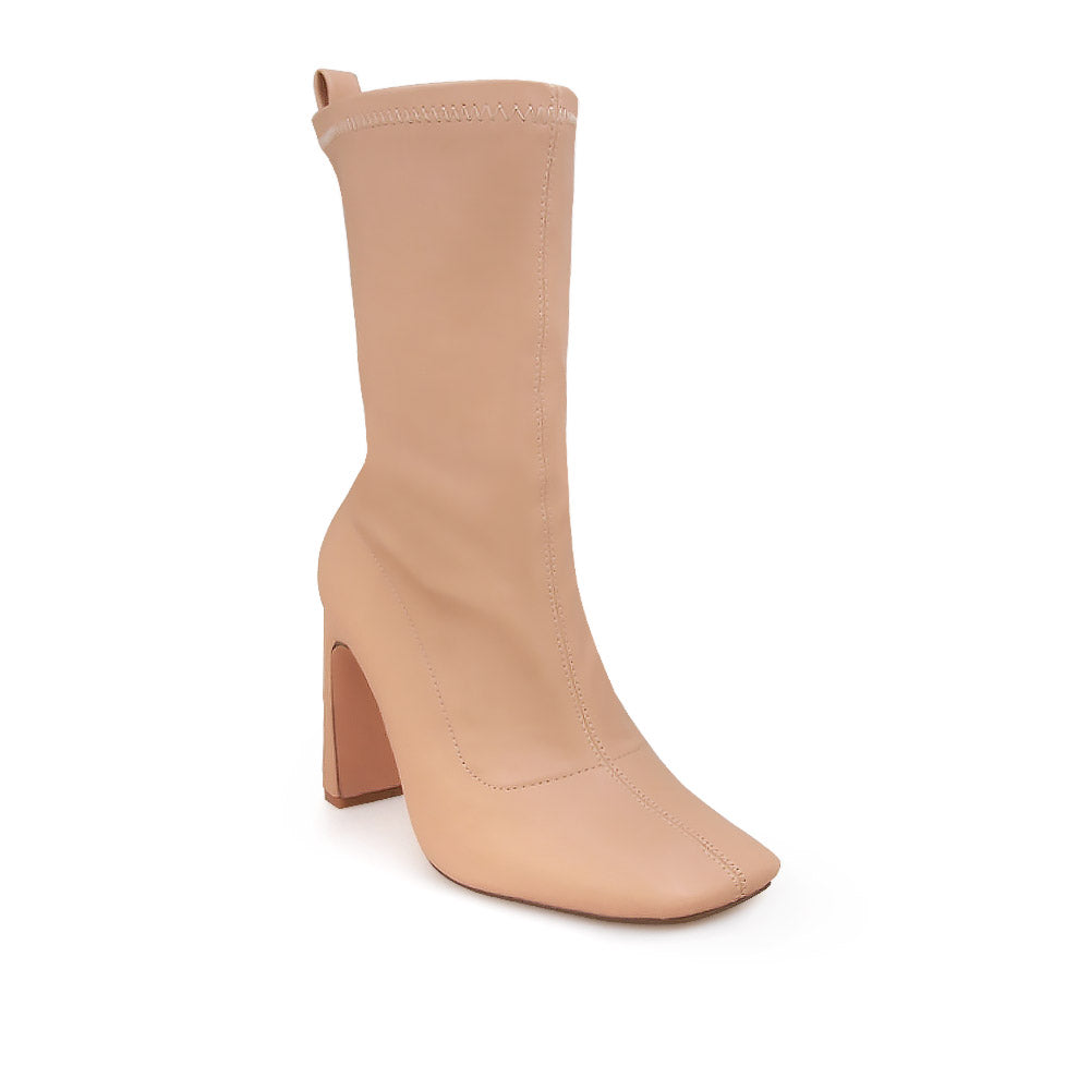 Ankle-high nude heels with a pointed toe and zip closure - corner view