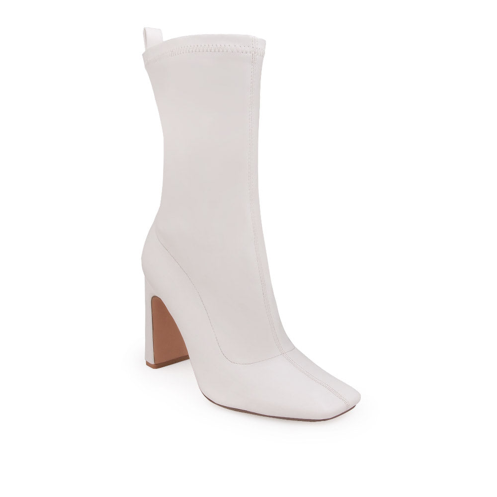 White ankle-high heels with a pointed toe and zip closure - corner view