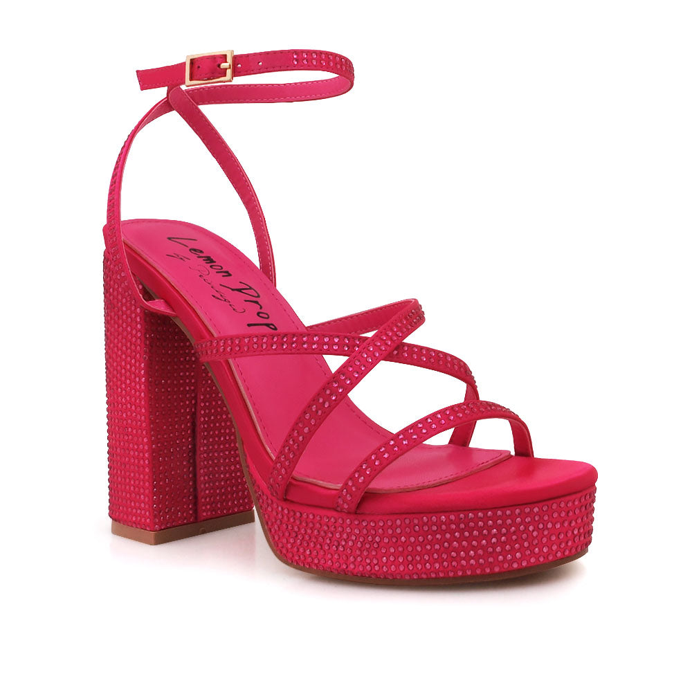 Fuchsia colored platform heels with crystal embellishment and ankle buckle closure  - corner view