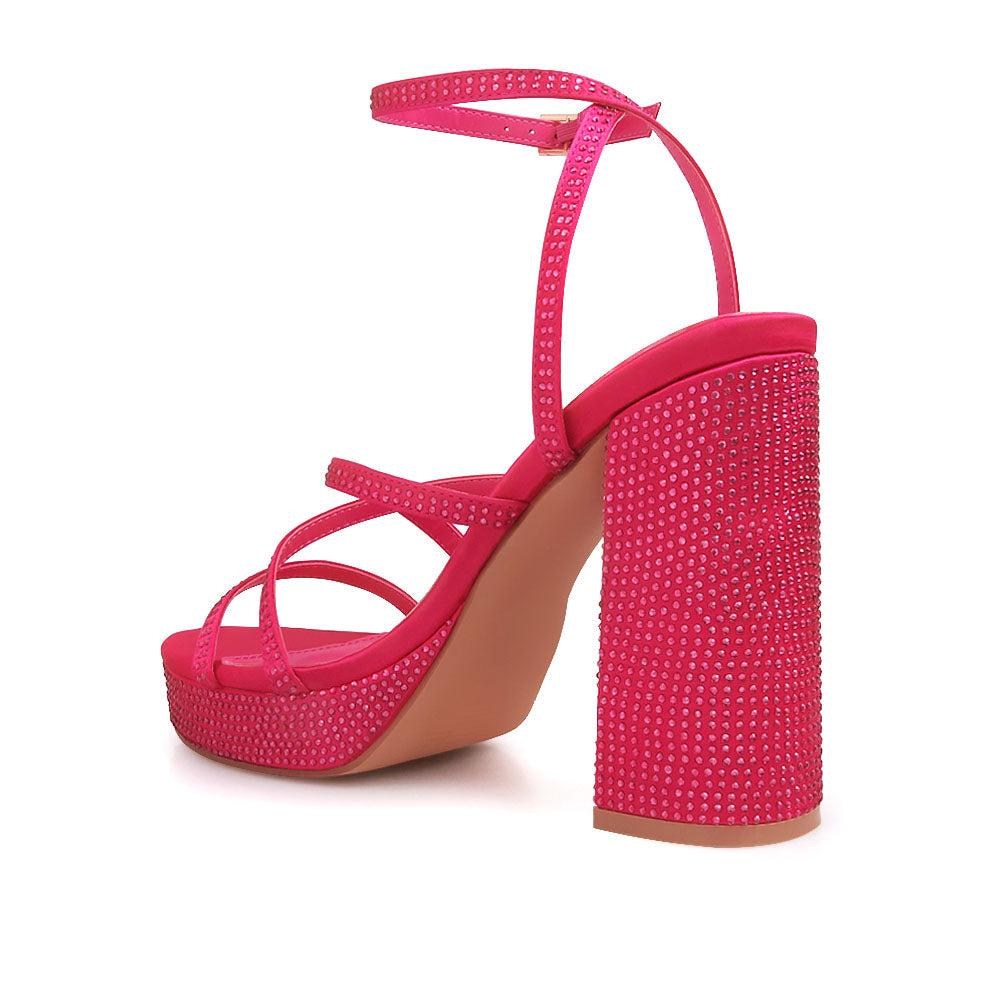 Fuchsia colored platform heels with crystal embellishment and ankle buckle closure - back view