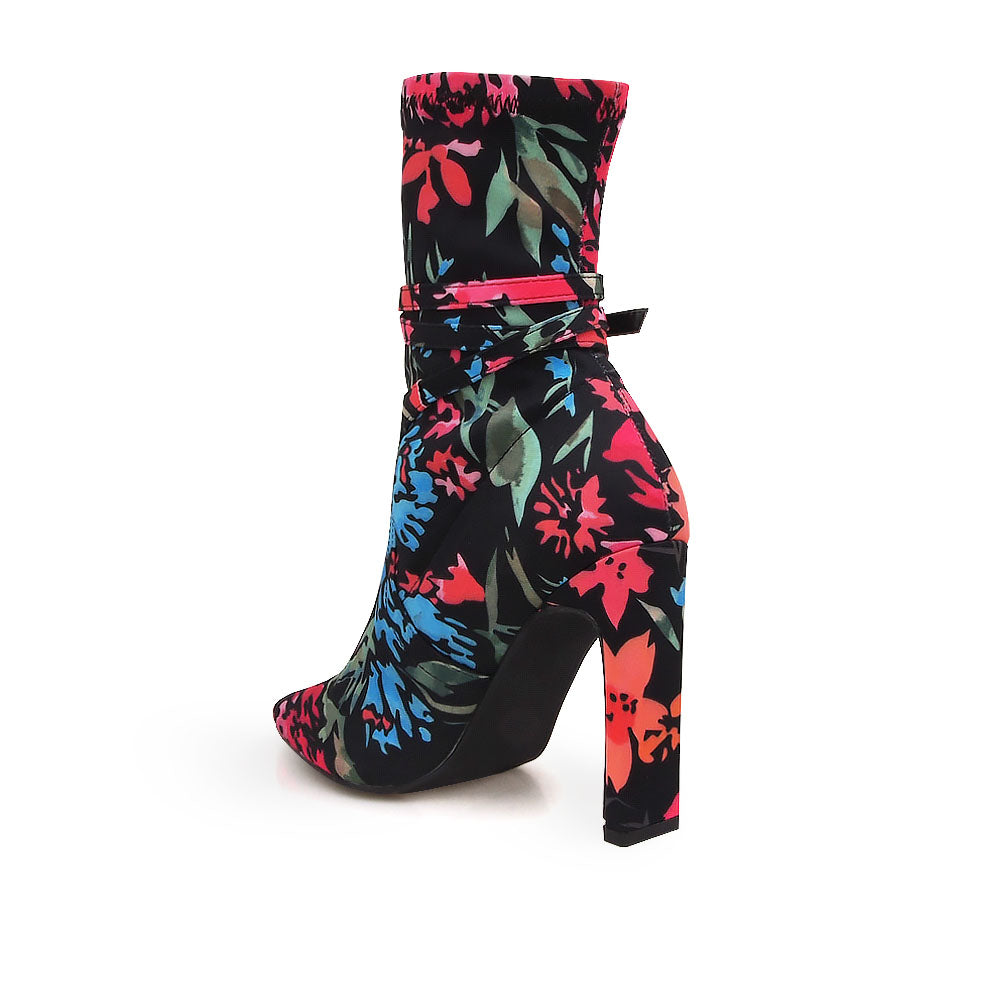 Ankle-high boot heels in black with pointed toe and multicolored floral print upper - back view 