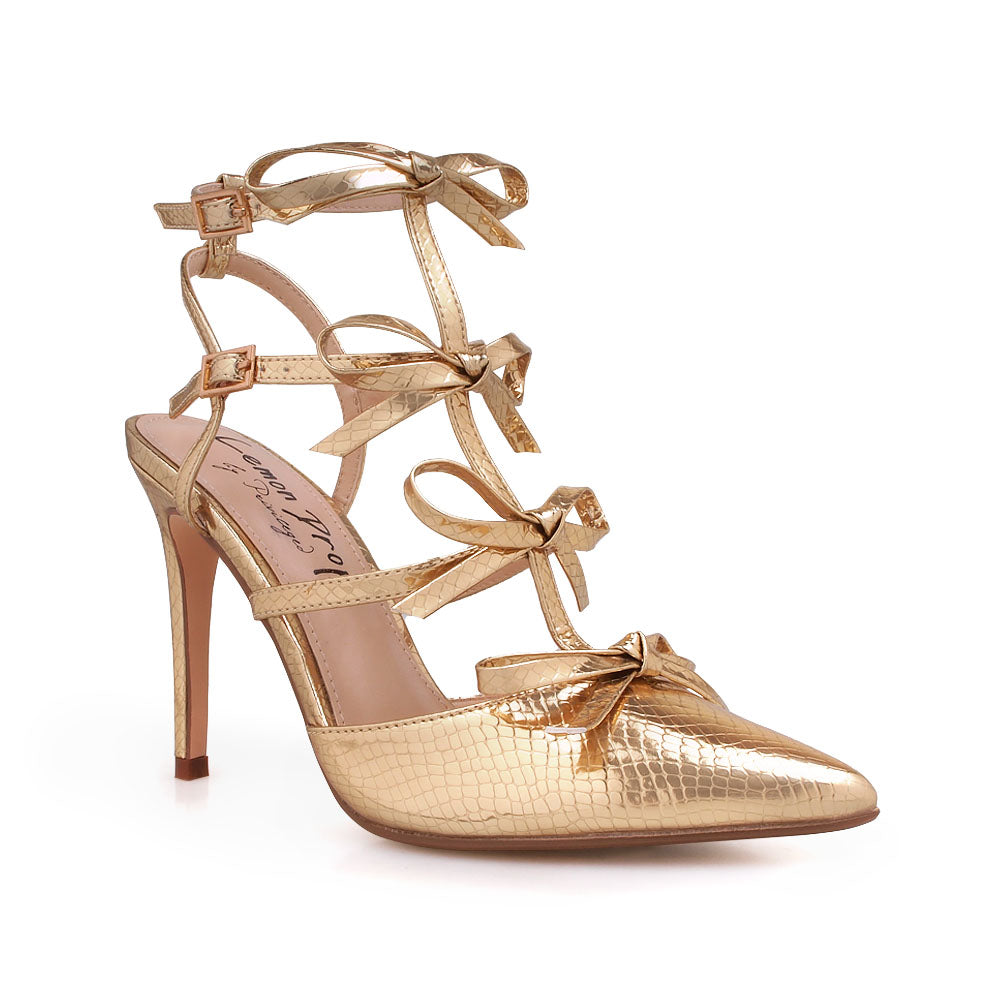 Golden stiletto sandals with bow design and double ankle strap - corner view