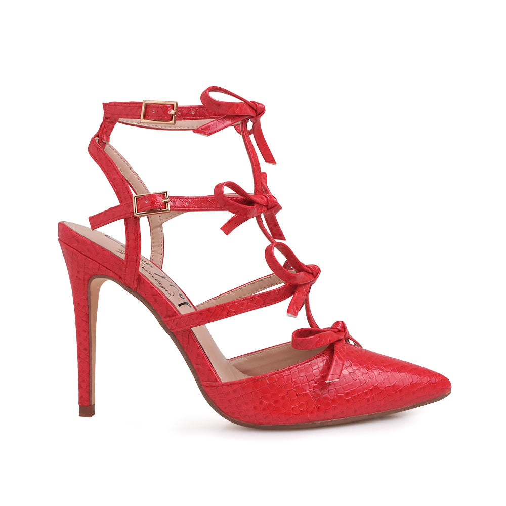 Red colored stiletto sandals with bow design and double ankle strap - side view