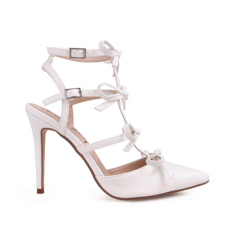 White stiletto sandals with bow design and double ankle strap - side view