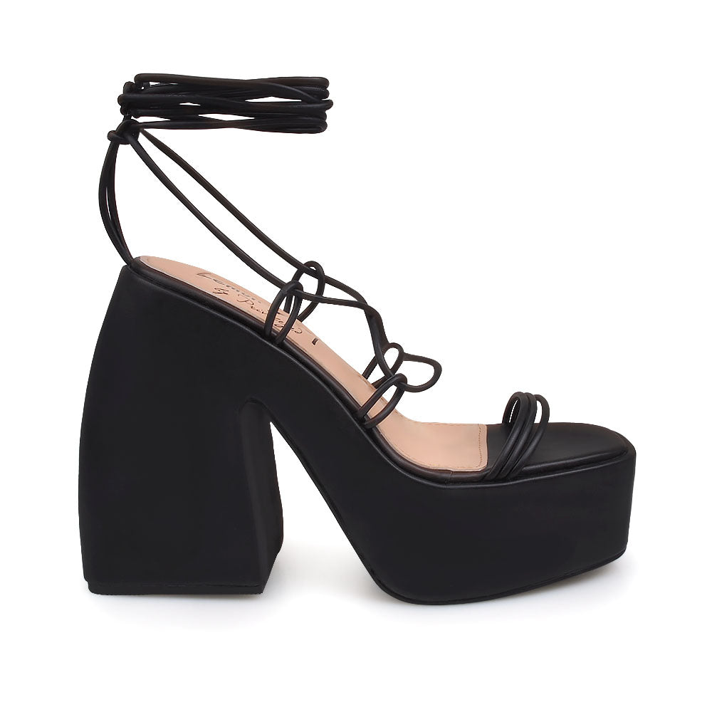 Black colored strappy platform heeled sandals - side view