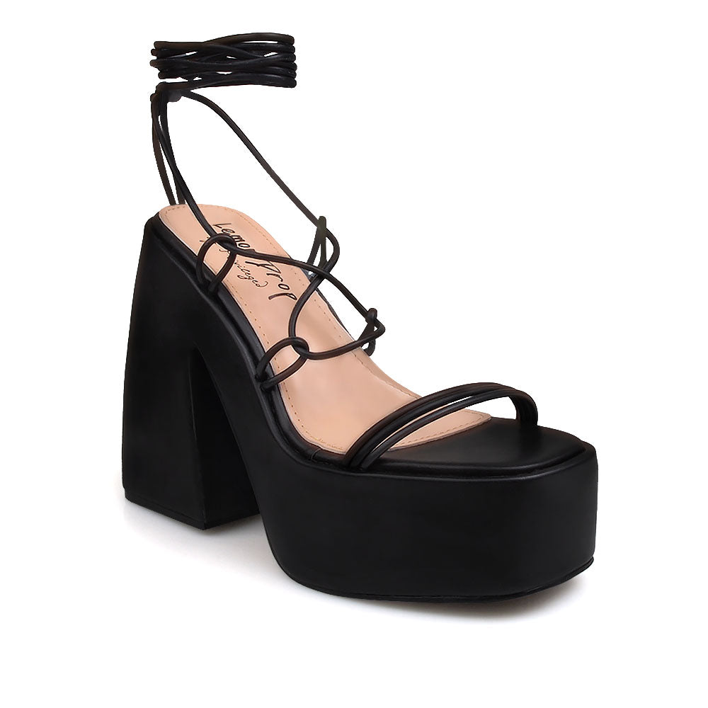 Black colored strappy platform heeled sandals - corner view