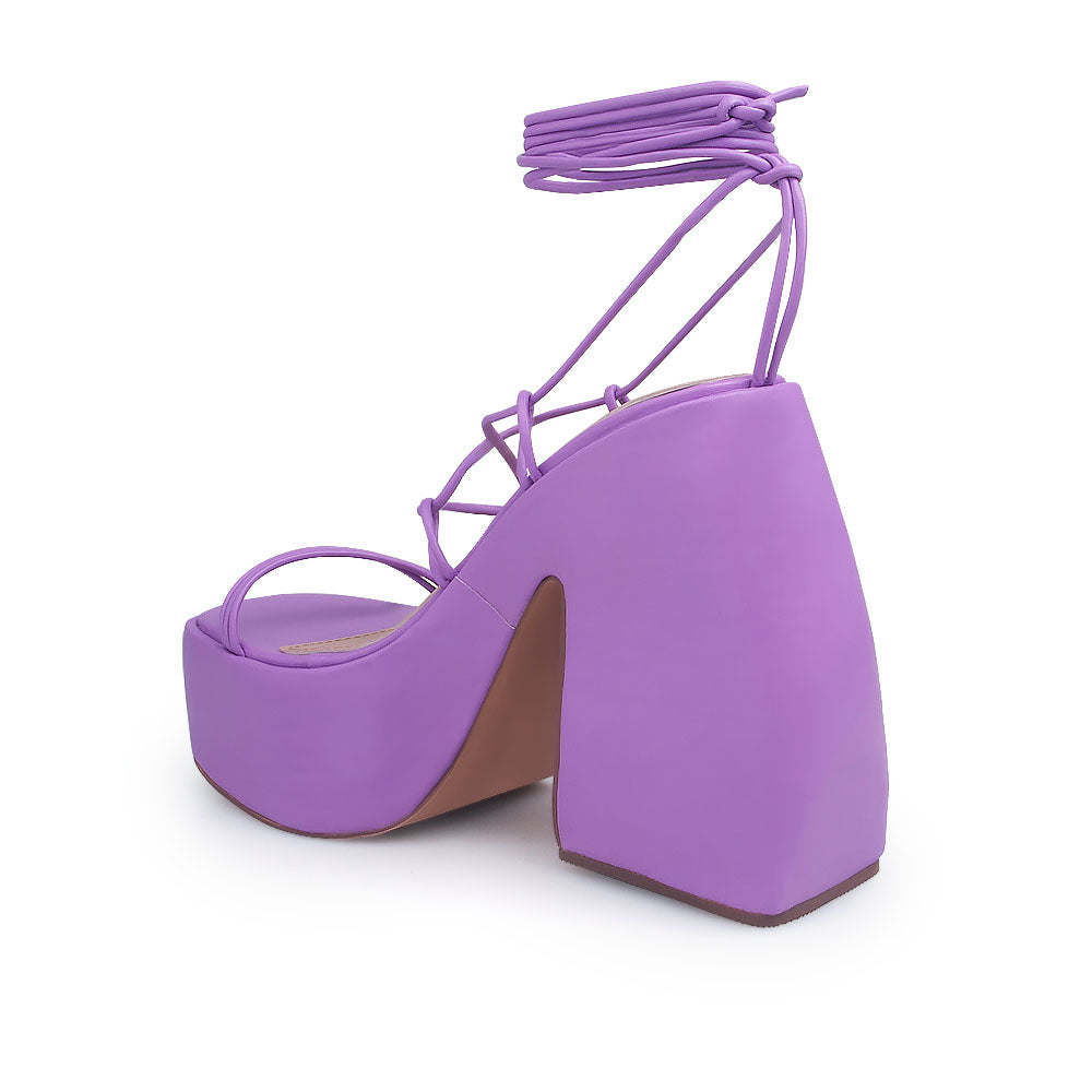 Purple colored strappy platform heeled sandals - back view