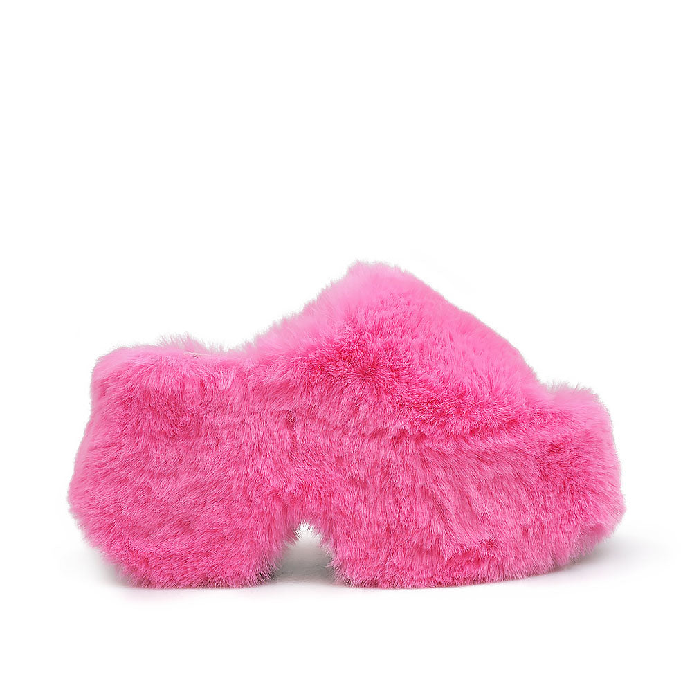 Pink furry platform sandals with open toe - side view