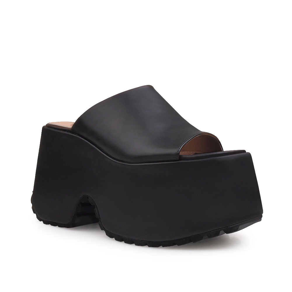 Black platforms with an open toe and slip-on style - corner view