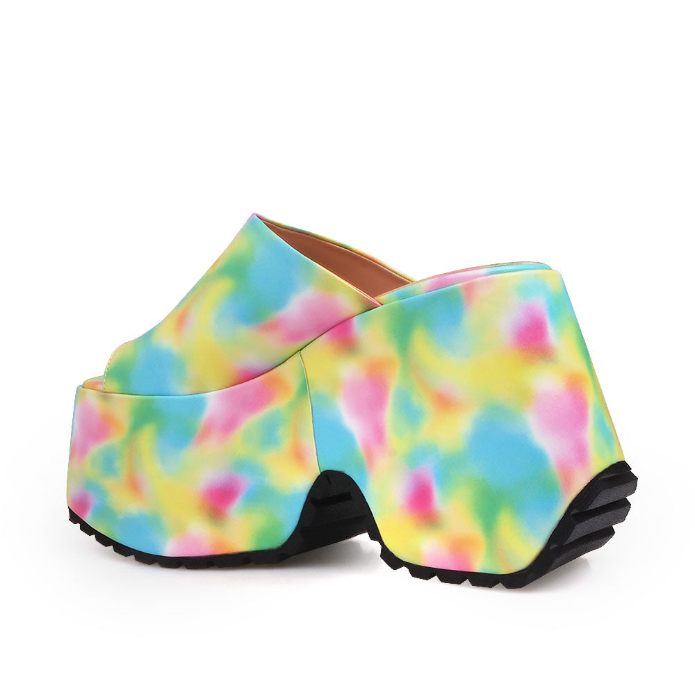 Platforms in multi-color with an open toe and a slip-on style - back view