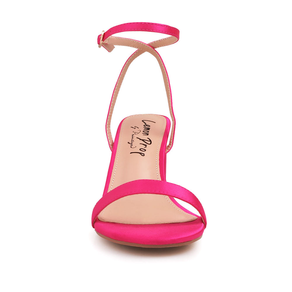 Open toe block heel sandals with ankle buckle closure in fuchsia color - front view