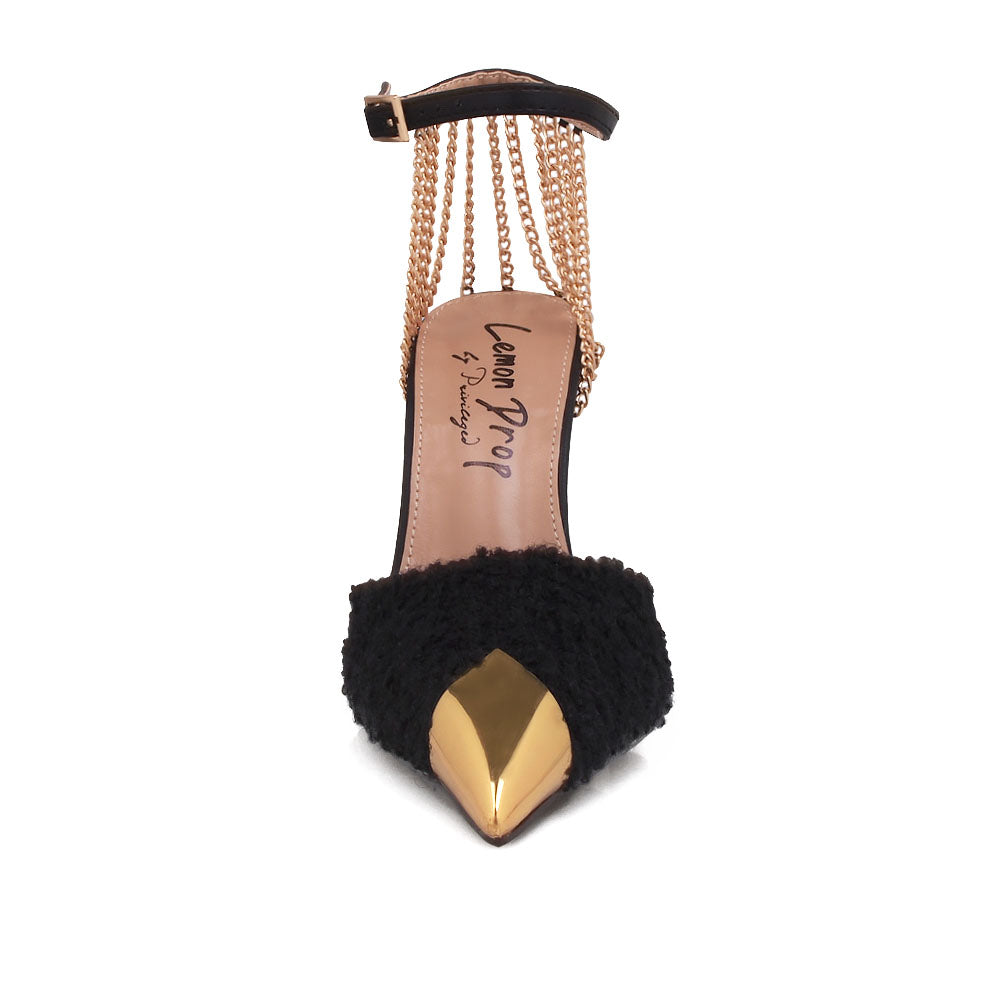 Black stiletto heels with gold chain accents and ankle buckle closure - front view