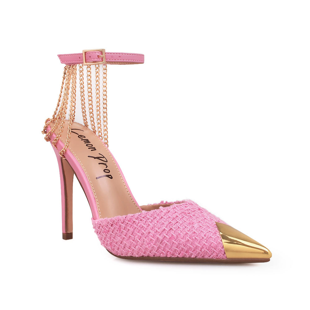 Pink stiletto heels with golden chain accent and ankle buckle closure - corner view