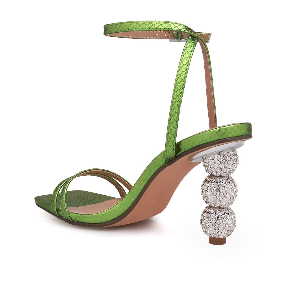 Silver crystal ball heel with green upper and ankle buckle closure - back view