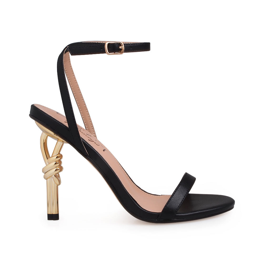 Black upper with ankle buckle closure and gold metallic heels - side view