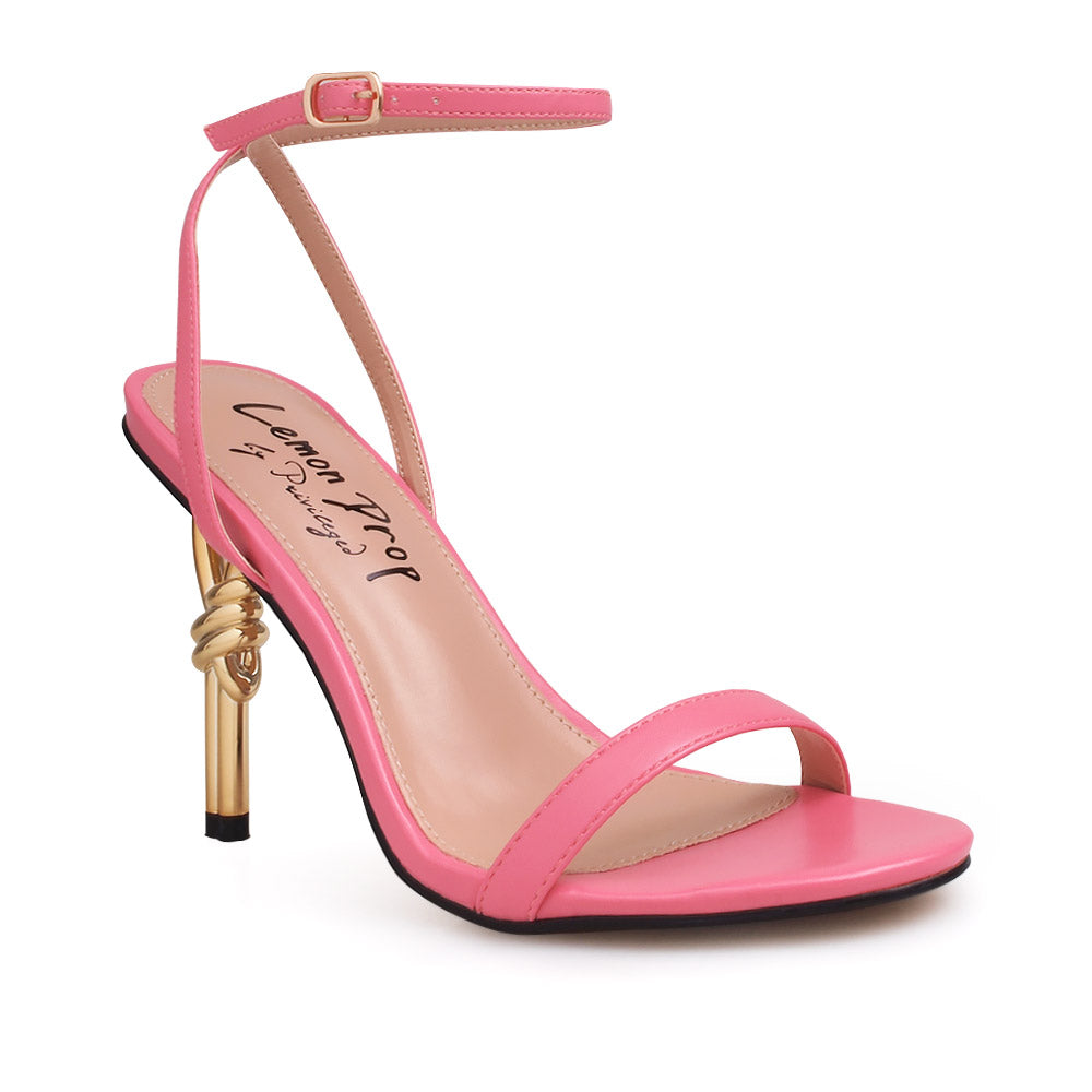 Coral color upper and ankle buckle closure on gold metallic heels - corner view