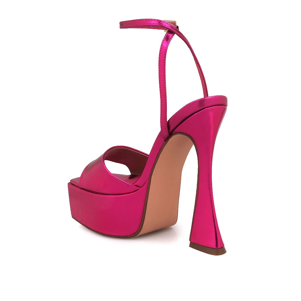 Fuchsia colored open toe platform heels with ankle strap closure - back view