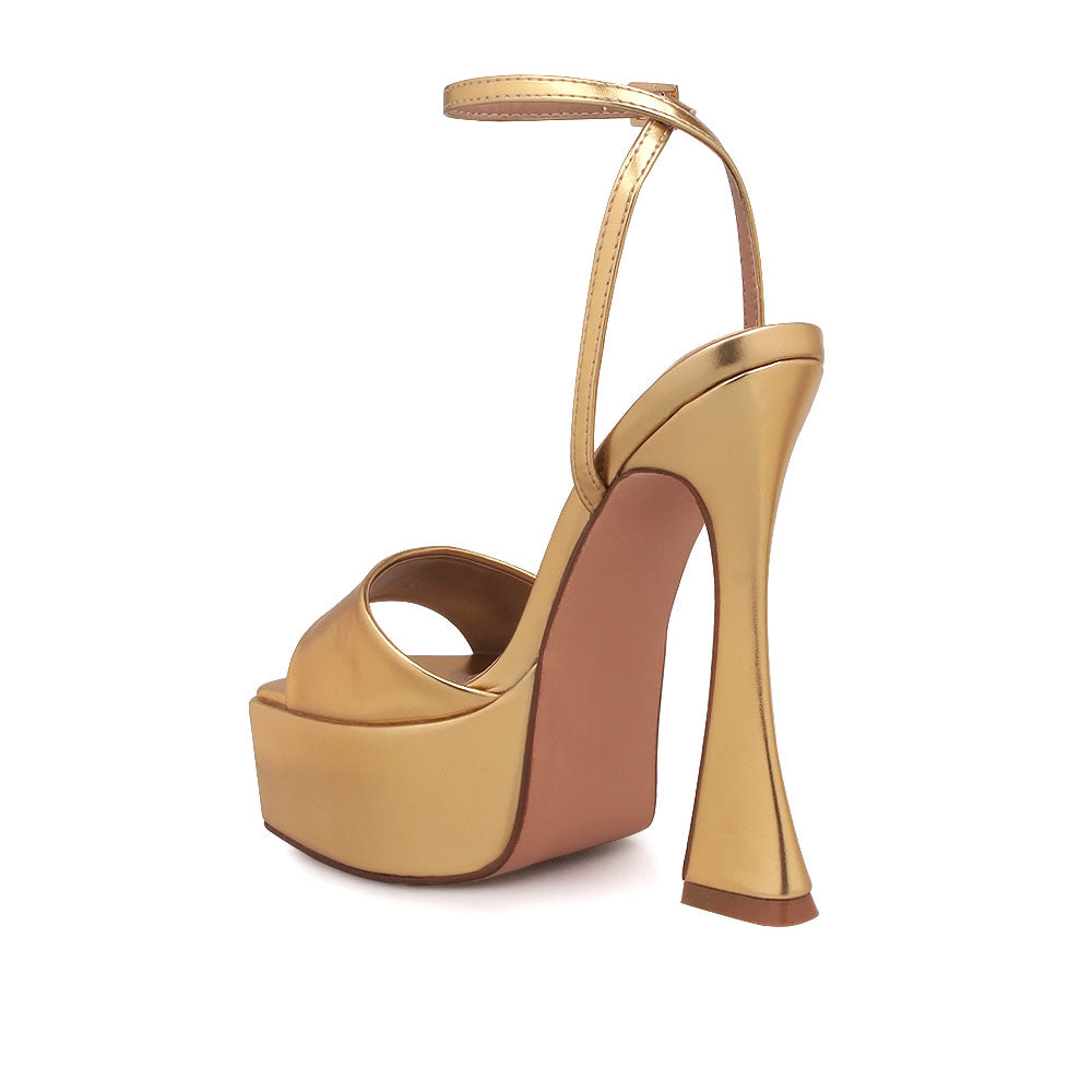 Golden platform heels with open toe and ankle buckle closure - back view