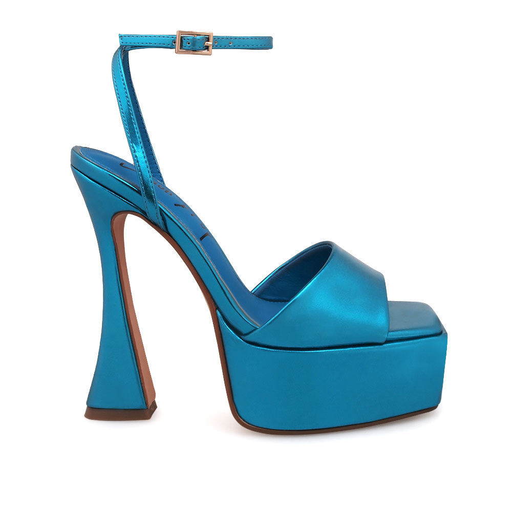 Turquoise platform heels with open toe and ankle buckle closure - side view