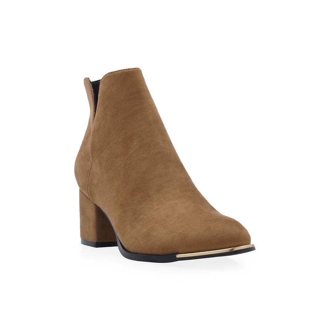 Tan colored ankle boots with block heels and open sides - corner view