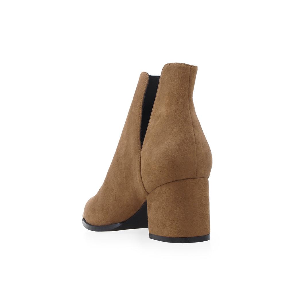 Tan colored ankle boots with block heels and open sides - posterior view