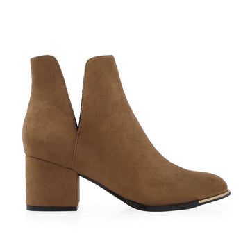 Tan colored ankle boots with block heels and open sides - side view
