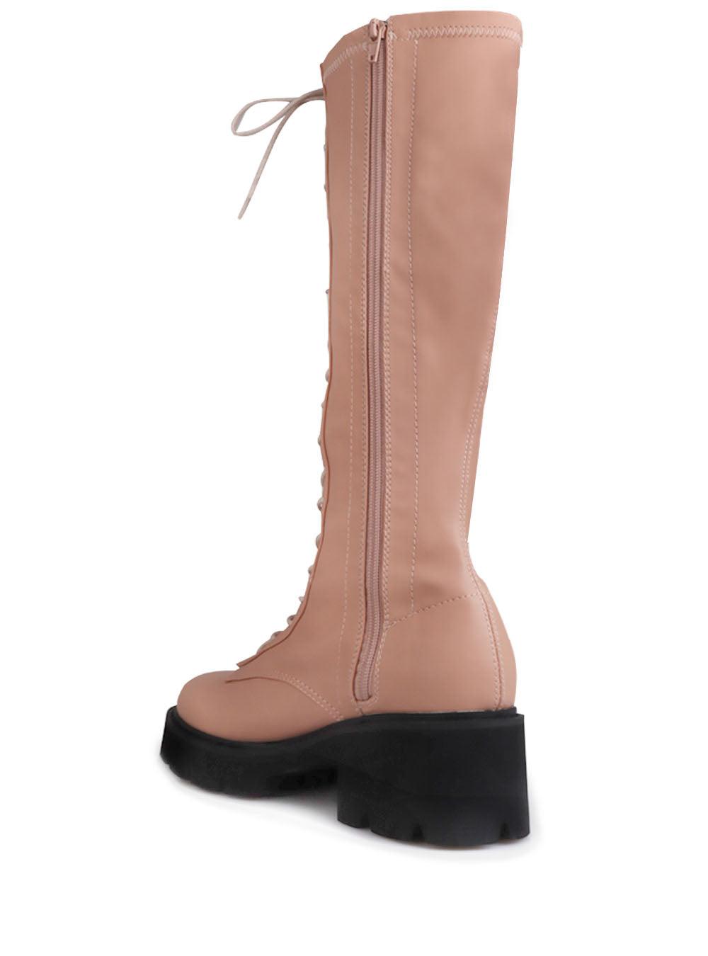 Women's nude-colored knee high boots with a lace up closure-posterior view