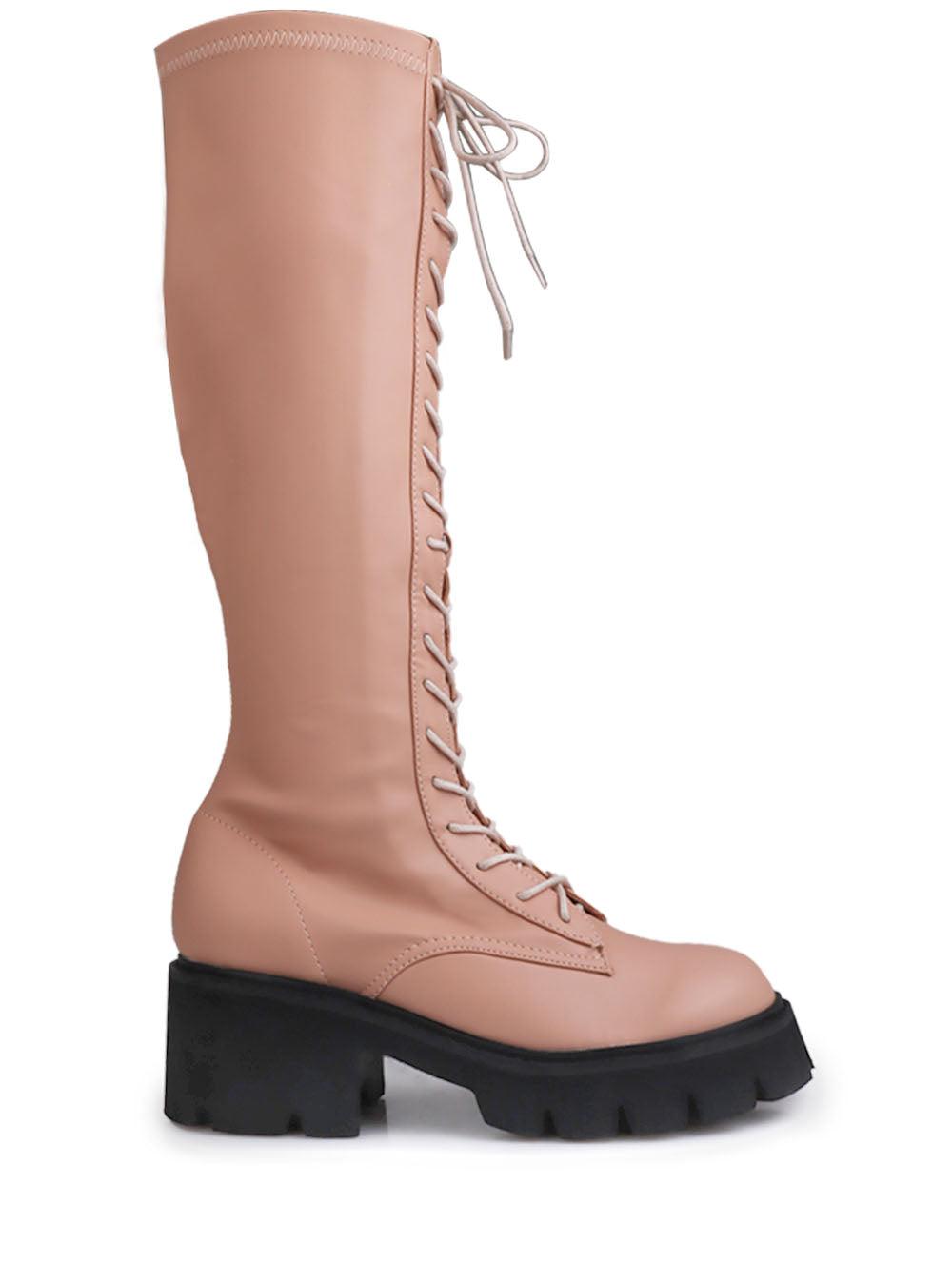 Women's nude-colored knee high boots with a lace up closure-side view