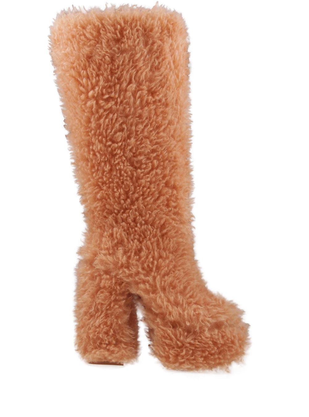 Tan-colored slip-on knee high boots with shearling top and block heels for women-side view