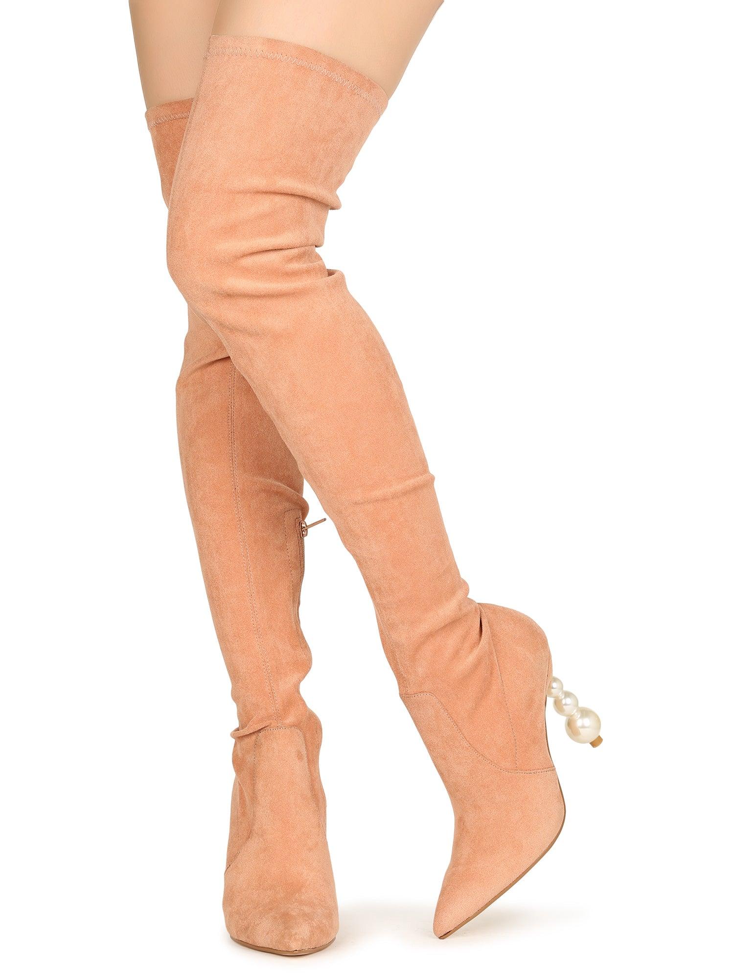 Nude colored women's long boots with pearl heel