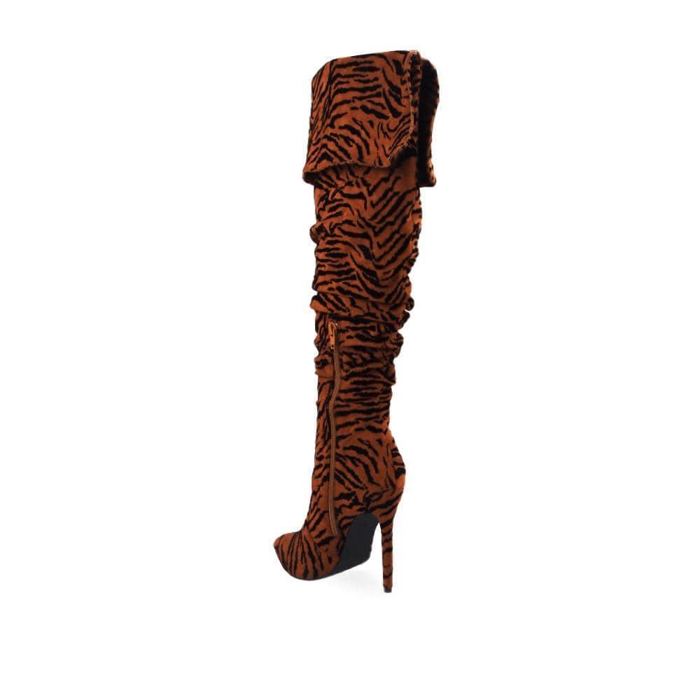 Cognac colored women boots with textured upper and stilleto heel-posterior view