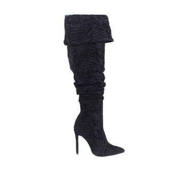 Black colored women boots with textured upper and stilleto heel-side view