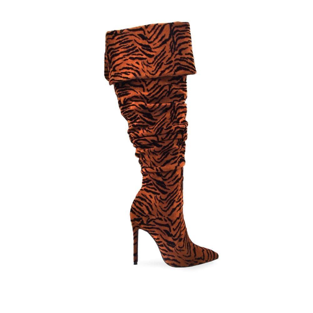 Cognac colored women boots with textured upper and stilleto heel-side view