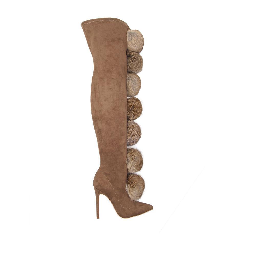 Brown colored women boots with pompoms 