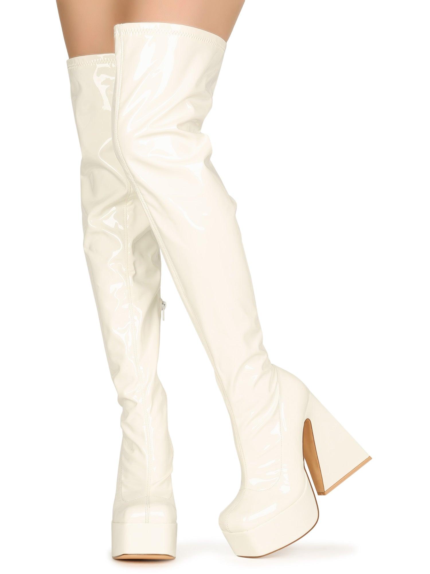 White colored women boots with block heel and platform