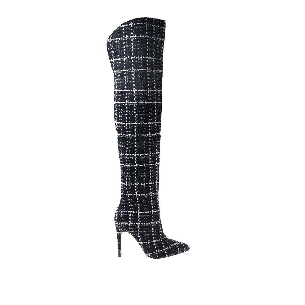 Black and white olored women boots with back slip