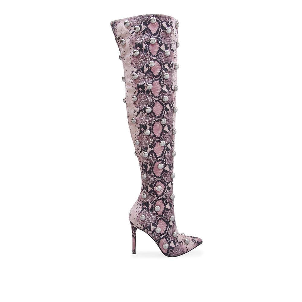 Women stiletto knee-high heel boot with silver studs in blush snake print